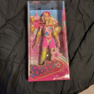 The Barbie Movie Margot Robbie Doll in Pink, Yellow, and Blue Roller Skate Suit